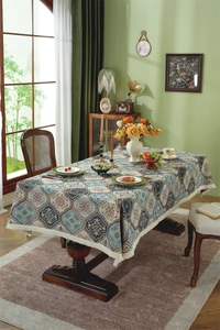Detail view of American vintage jacquard tablecloth with bohemian patterns and white tassels