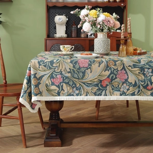 Vintage floral jacquard tablecloth with fringe, featuring teal green botanical patterns