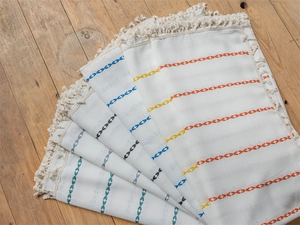 Detail of geometric embroidery and fringe on boho style polyester jacquard curtains