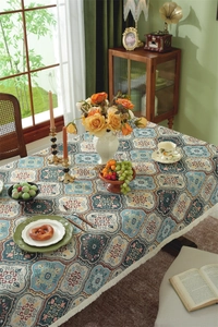 Detailed macro view of American vintage jacquard tablecloth with white tassel fringes