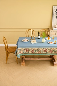 Detailed texture of blue jacquard tablecloth with ethnic floral embroidery patterns