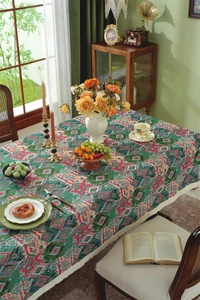 Detailed shot of ethnic geometric pattern jacquard tablecloth with creamy white tassels