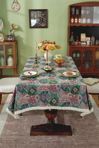 Close-up of vintage jacquard tablecloth with ethnic floral patterns and white fringe