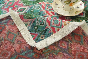 Detailed texture of jacquard fabric with ethnic patterns and fringe for coffee tables