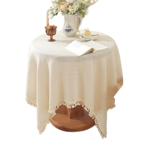Beige rectangular tablecloth with tassels and waffle texture for dining and coffee tables