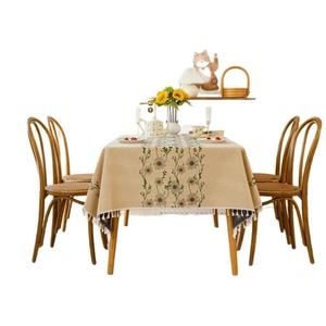 Pastel pastoral floral jacquard tablecloth with white tassels on rectangular wood table