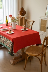 Detailed close-up of red American vintage tablecloth with ethnic floral jacquard patterns
