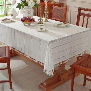 Elegant off-white hollowed lace tablecloth with geometric stripes and fringe tassels