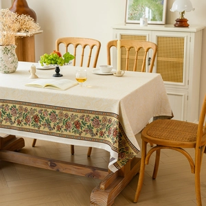 Vintage floral jacquard tablecloth with elegant botanical pattern on cream cotton fabric