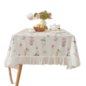 Pastel floral cotton tablecloth with elegant ruffled edges and green plant pattern