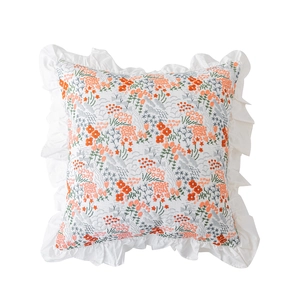 French country cotton pillowcase with floral embroidery and ruffled edges in white