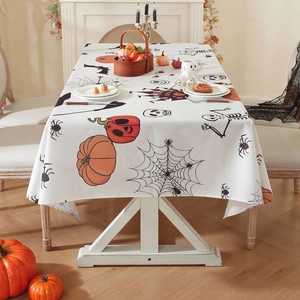 Polyester Halloween tablecloth featuring pumpkins, bats and ghosts on a cream base