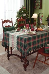 Detailed close-up of a festive Christmas table runner with red and green plaid patterns