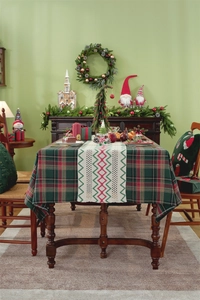 Close-up of a festive plaid Christmas table runner with red wave patterns and knit details