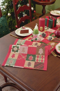 Detailed view of Christmas jacquard table runner with festive tree and gift patterns