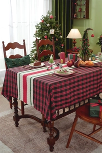 Close-up of festive Christmas table runner with red plaid pattern and neat edge stitching