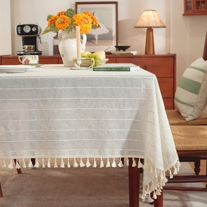 Linen texture tablecloth with beige stripes and tassels for rustic dining decor