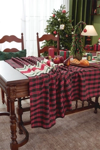 Close-up of red and black buffalo check Christmas table runner with festive embroidery