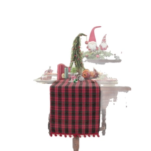 Christmas red and black tartan table runner with decorative red pompom fringe accents