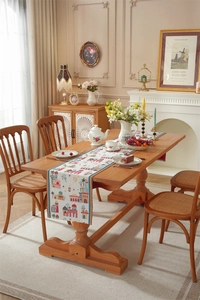 Detailed woven texture of polyester table runner with moon, stars and castle embroidery