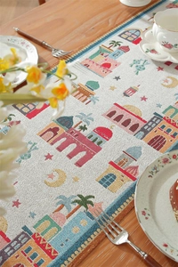 Detail of Middle Eastern jacquard table runner with mosque motifs and colorful borders