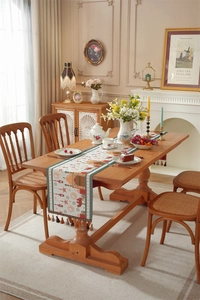 Detailed texture of Middle Eastern table runner featuring woven star and moon embroidery