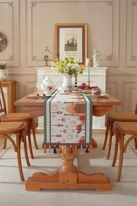 Detail of jacquard table runner with mosque patterns and tassel fringe decorations