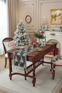 Detail of Christmas table runner with jacquard tree patterns and fringe tassels