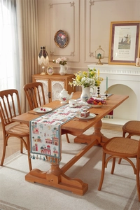Detail of Middle East moon festival table runner with blue tassels and mosque prints