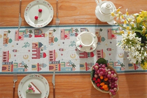 Detailed view of woven table runner with Middle Eastern castle and moon patterns