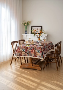 Close-up of bohemian jacquard tablecloth with geometric patterns and white fringe details