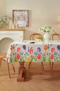 Detailed view of tulip floral print and tassel edges on poly-cotton rectangular tablecloth