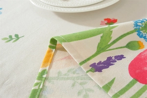 Detail of tulip floral print on polyester cotton tablecloth with fine edge stitching
