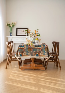 Close-up of bohemian jacquard tablecloth featuring colorful patterns and white tassels