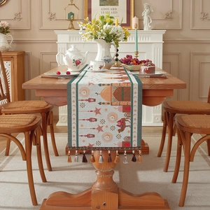 Jacquard table runner with Middle Eastern moon and star patterns and colorful tassels