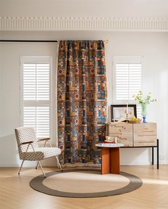 Detail of bohemian jacquard curtain with colorful geometric patterns and beige tassels