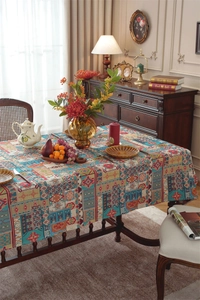 Close-up detail of bohemian jacquard tablecloth with vintage floral and geometric patterns