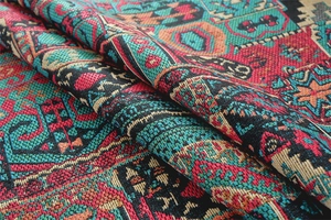 Detailed macro shot of vintage bohemian jacquard fabric with geometric patterns