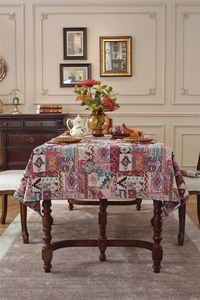 Detail of bohemian jacquard fabric featuring colorful geometric patterns on a wooden table