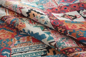 Macro shot of colorful bohemian jacquard fabric with geometric patterns and floral details