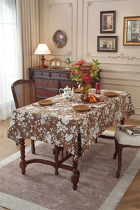 Detailed view of vintage bohemian floral jacquard fabric with deep brown texture