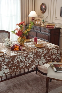 Close-up of bohemian floral jacquard tablecloth with detailed vintage brown and white patterns