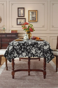Detailed close-up of Bohemian floral and geometric pattern on retro woven tablecloth