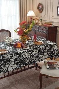 Close-up of black and white bohemian floral jacquard tablecloth with premium drape