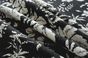 Close-up of bohemian floral jacquard fabric with detailed retro pattern texture