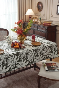 Detailed view of dark green Bohemian floral tablecloth with heavy jacquard texture