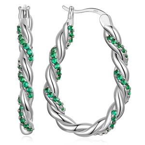 Macro detail of silver twisted hoop earrings with green zircon stones and S925 hallmark