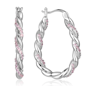 Macro shot of silver twisted hoop earrings with pink zircons and S925 hallmark