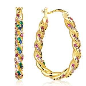 Macro shot of S925 silver stamp on gold-plated twisted earrings with colorful zircons