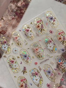 Macro view of YT7116Pro floral nail stickers with gold outlines and laser luster effect
